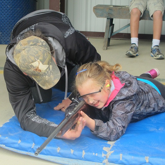 Warren helping Mallory Take Aim